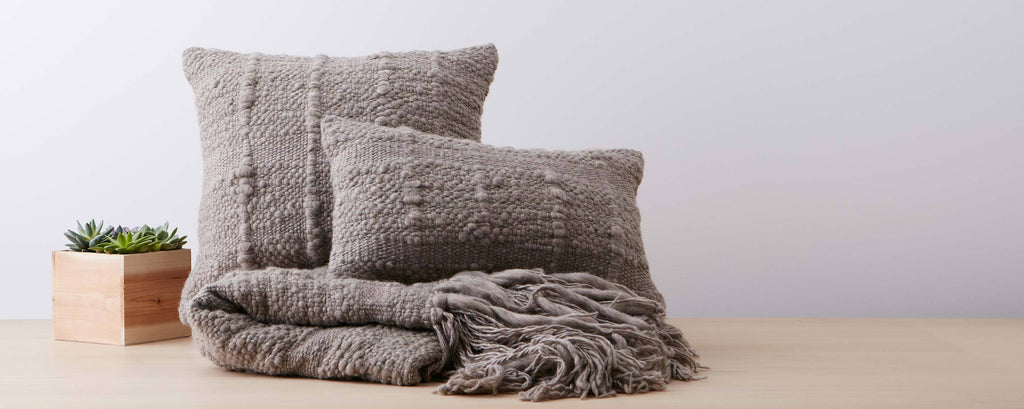 grey vertebra pillows and throw