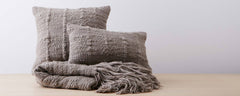 grey vertebra pillows and throw