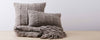 grey vertebra pillows and throw