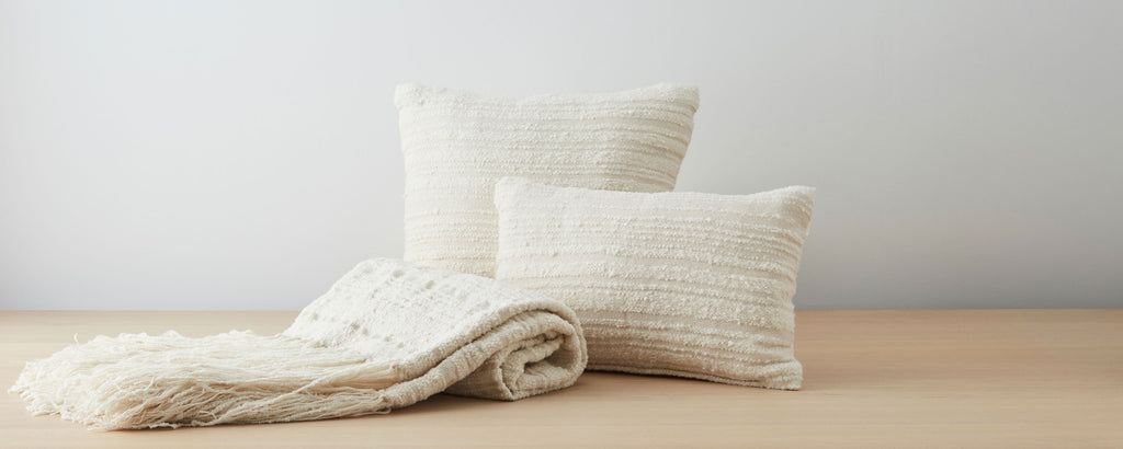 llama boucle pillows and throw