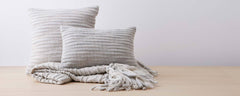 light gray caterpillar pillows and throw