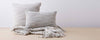 light gray caterpillar pillows and throw