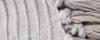 light gray caterpillar pillows and throw