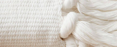 white cotton pillows and throw
