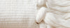 white cotton pillows and throw